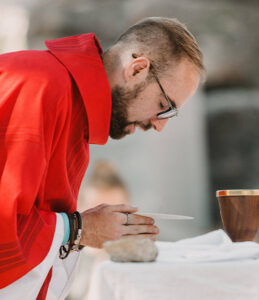 Priest during the consecration at Mass